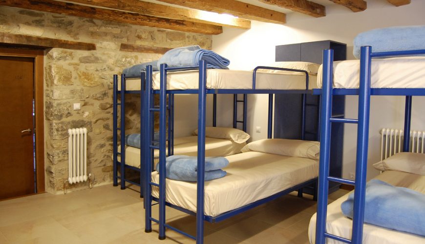 multiple bunk beds in a room